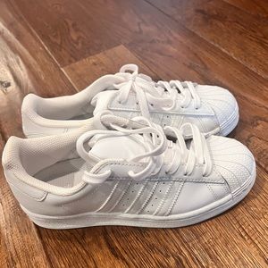 All white shell top adidas sneakers
